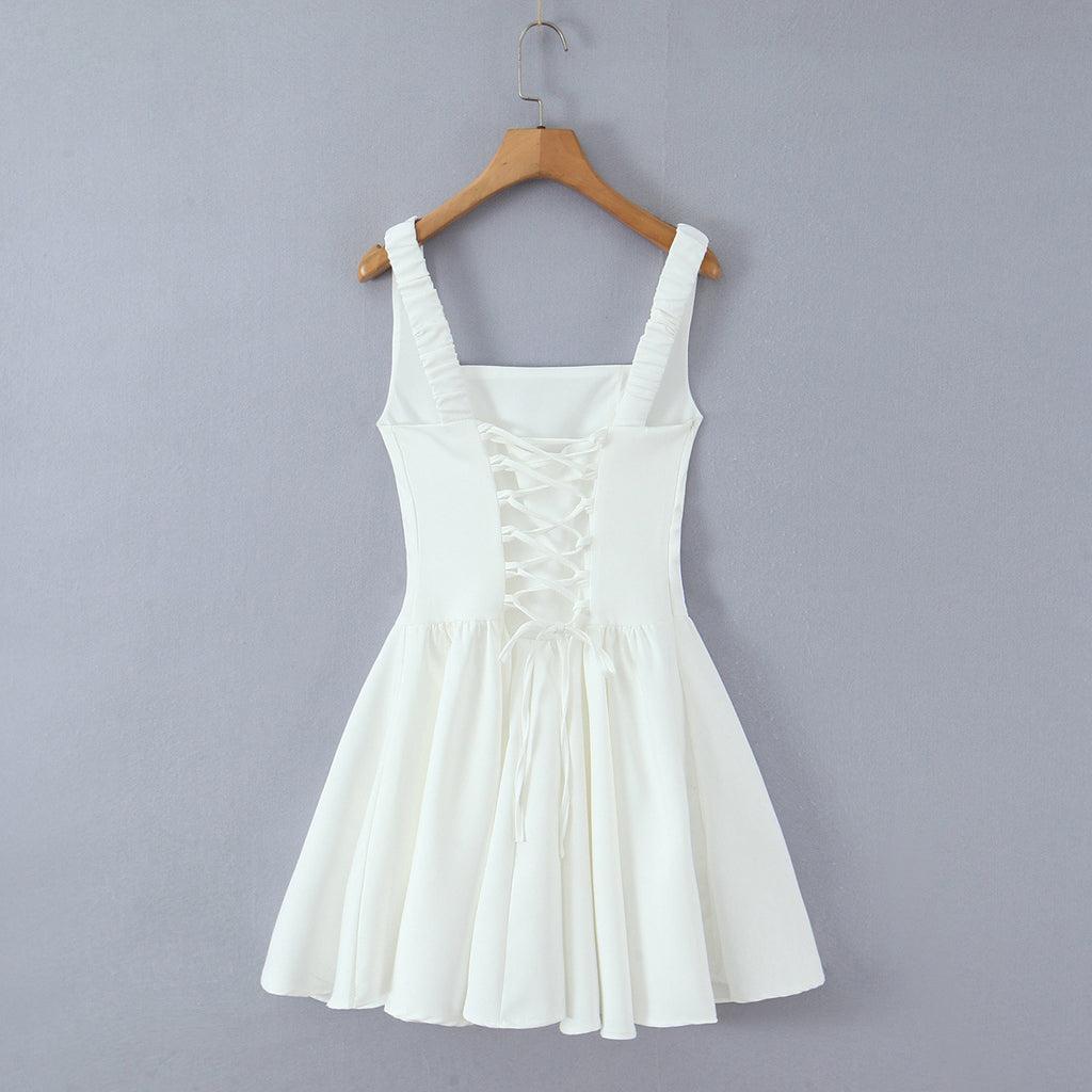 Spicy girl with shoulder straps and pleated dress